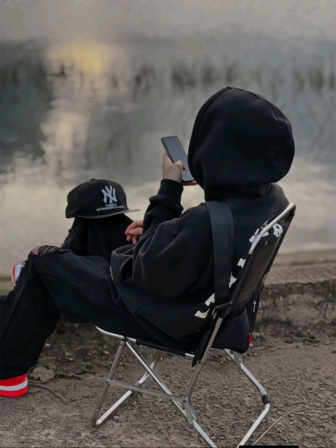 Broken DP For Instagram boy sitting alone in a black hoodie with an emotional dark aesthetic background